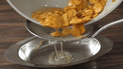 Pan Of Food Poured Into Bowl GIF
