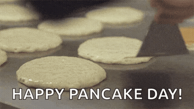 Pan Of Pancakes Saying Happy Pancake Day GIF