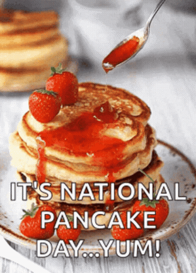 Pancakes With Syrup And Strawberries Saying It's National Pancake Day Yum GIF