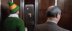 Papa Elf Playing Elevator Buttons GIF