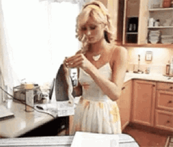 Paris Hilton Playing With Iron GIF