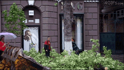 Passing Girl With Umbrella Almost Hit GIF
