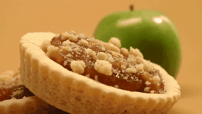 Pastry With Crumbs Next To Green Apple GIF