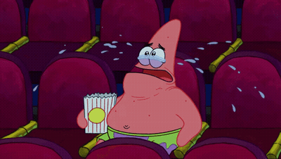 Patrick Star Crying While Holding A Bag Of Popcorn In A Theater GIF