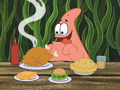 Patrick Star From Spongebob Is Sitting At A Table Eating Food GIF