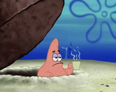 Patrick Star From Spongebob Squarepants Is Holding A Cup Of Coffee While Sitting In A Hole In The Sand . GIF