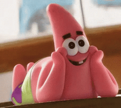 Patrick Star From Spongebob Squarepants Is Laying On A Table With His Hands On His Face And Smiling . GIF