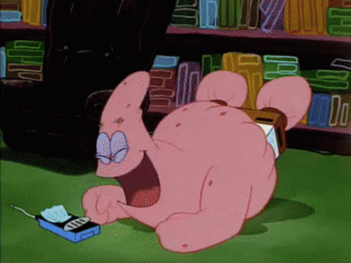 Patrick Star From Spongebob Squarepants Is Laying On The Floor Looking At A Phone GIF