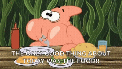 Patrick Star From Spongebob Squarepants Is Sitting At A Table With A Plate Of Food And A Bottle Of Ketchup . GIF