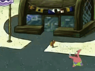 Patrick Star From Spongebob Squarepants Is Standing In Front Of A Building With Flags On It GIF