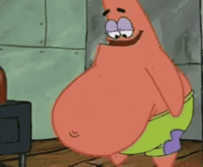 Patrick Star From Spongebob Squarepants Is Standing In Front Of A Stove . GIF