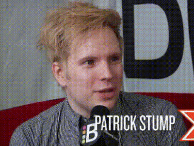 Patrick Stump Sitting At Microphone Talking GIF