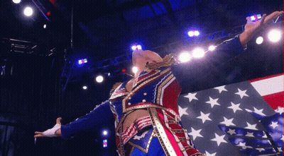 Patriotic Man Arms Outstretched In Front Of American Flag GIF