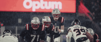 Patriots Football Players Lined Up In Front Of Optum Sign GIF