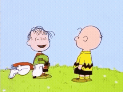 Peanuts Characters Playing In Grass With Dog GIF