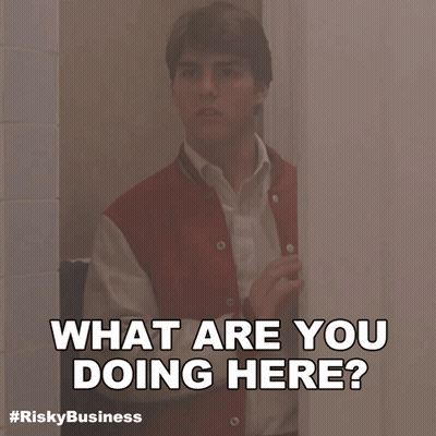 Peeking Red Jacket Man Behind Door What Are You Doing Here GIF