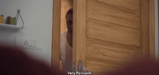 Peeping Tom Snooping Behind Door GIF