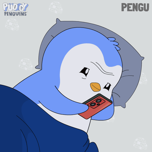 Penguin Lying On Pillow With Hearts GIF