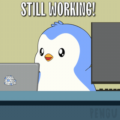 Penguin Sitting At Desk With Laptop Saying Still Working GIF