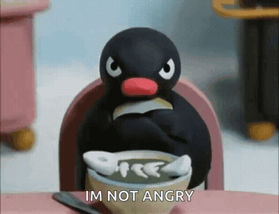 Penguin Sitting At Table Saying Im Not Angry GIF