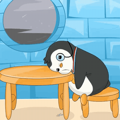 Penguin Sitting At Table With Medal GIF