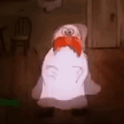 Penguin Sitting In Chair With Red Bow Tie GIF