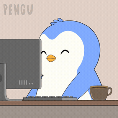 Penguin Sitting in Front of Computer