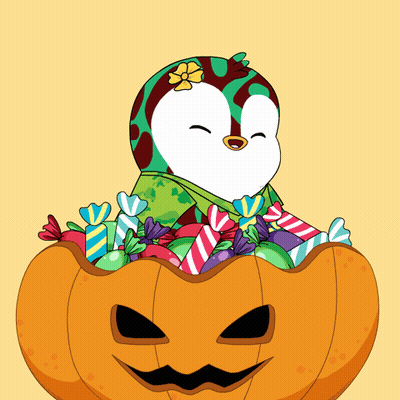 Penguin Sitting In Halloween Pumpkin With Candy GIF