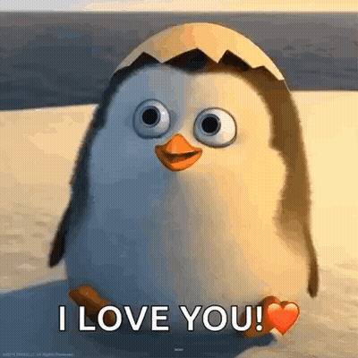 Penguin Sitting On Beach With Heart Saying I Love You GIF