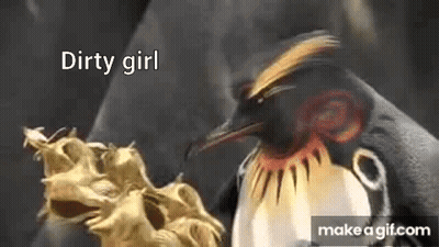 Penguin Standing Next To Dragon Statue Saying Dirty Girl GIF