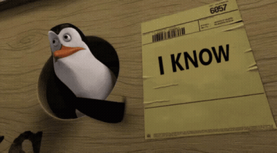 Penguin Sticking Head Out of Paper Hole
