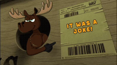Penguin Sticking Head Through Paper Saying It Was A Joke GIF