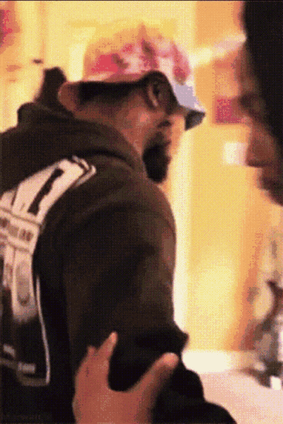 Penguins Standing Together In Outfits GIF