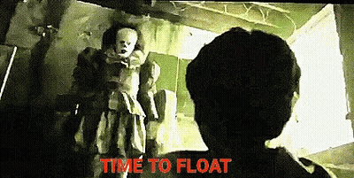 Pennywise The Clown Standing Next To Man In Room GIF