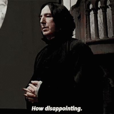 People And Man In Black Cape Around Table With Bottles GIF