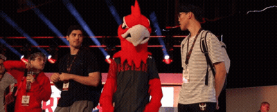 People And Mascot In Black Hawk Shirt GIF