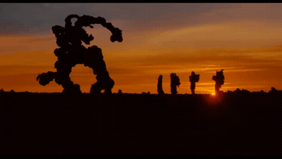 People And Robot In Field GIF