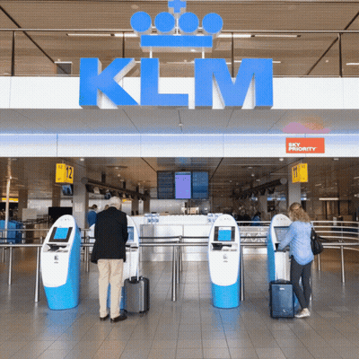 People At KLM Sign Waiting To Check In GIF
