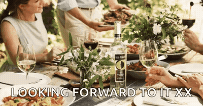 People At Table With Bottle Looking Forward To It XX GIF