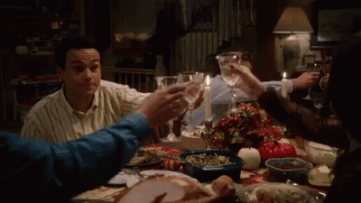 People At Table With Food And Wine GIF