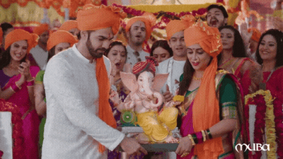 People Carrying Ganesha Statue On Carriage GIF