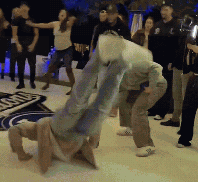 People Dancing By Ford Sign GIF