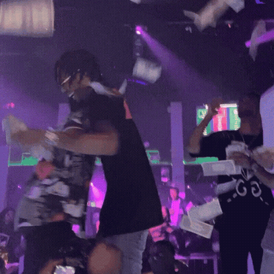 People Dancing In Club With Purple Lights GIF