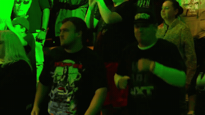 People Dancing In Dark Room With Green Lights GIF