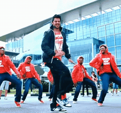 People Dancing in Front of Building