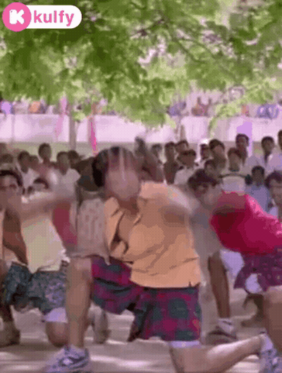 People Dancing In Front Of Crowd With Kulfy Logo GIF
