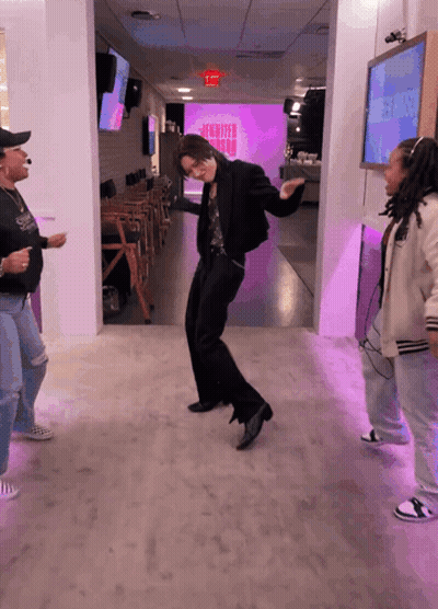 People Dancing In Front Of Jennifer Aniston Screen GIF
