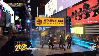 People Dancing In Front Of Judgement Free Sign GIF