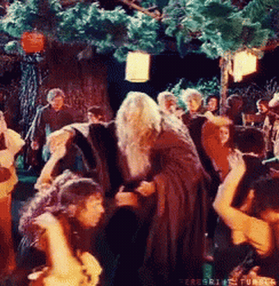 People Dancing In Front Of Tree In Forest GIF