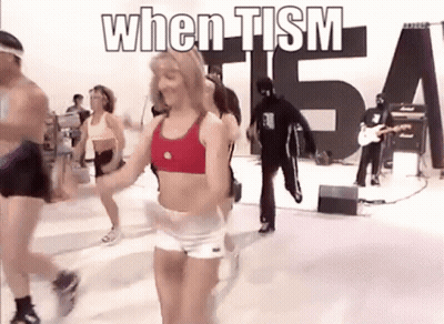 People Dancing In Front Of When Tism Sign GIF